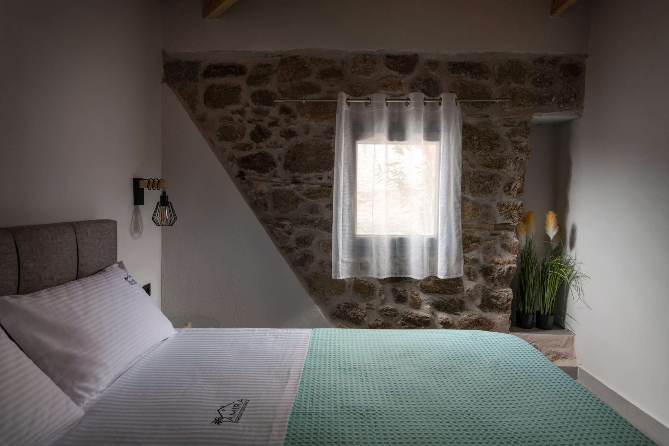 amira-house-sykia-wood-beam-stone-wall1